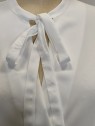 Blusa donna bianca girocollo fiocco Kartika particolare fiocco Con senso abbigliamento Torino